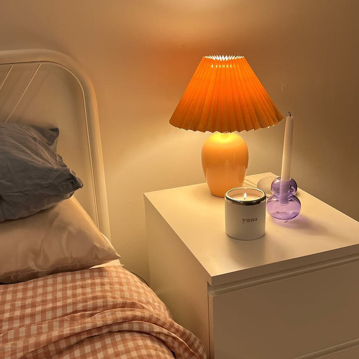 Yuno's refillable candle lit in bedroom