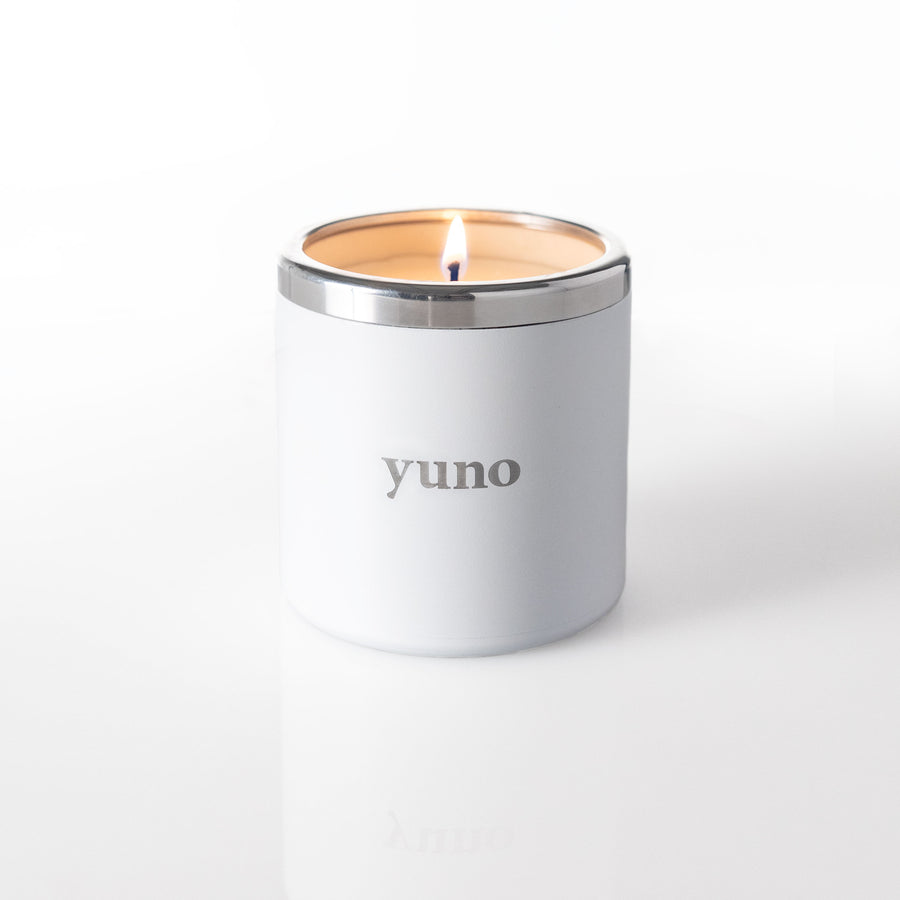 Yuno's refillable candle lit